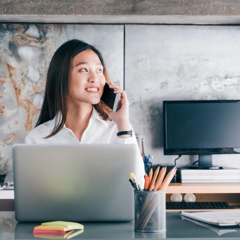 a female calling someone on her phone